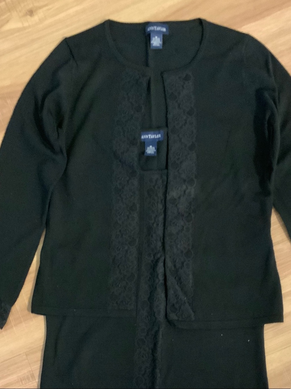Ann Taylor Black Lace-Trim Open Cardigan
Plus she’ll